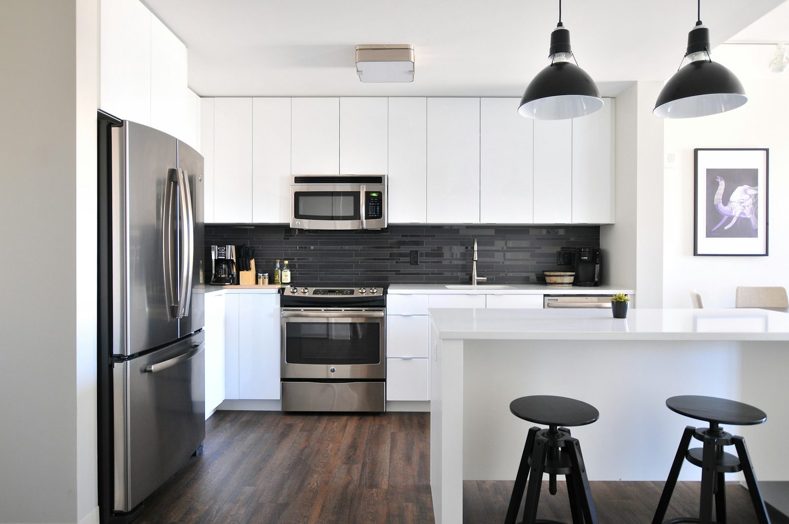 Modern kitchen with a refrigerator, stove and microwave