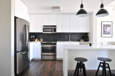 Modern kitchen with a refrigerator, stove and microwave